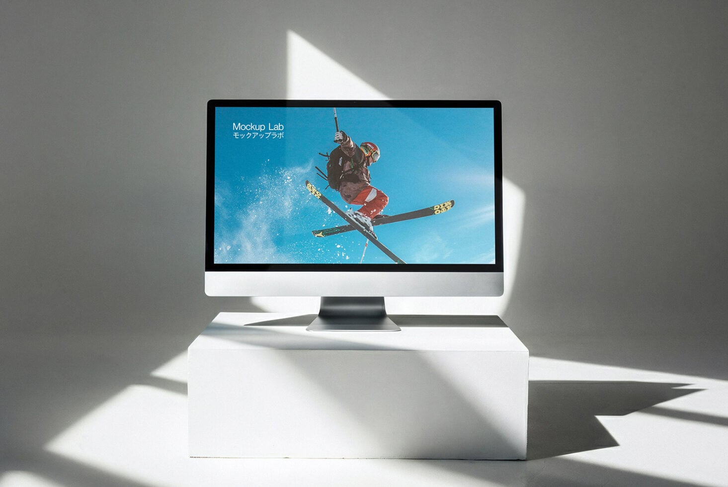 Desktop screen displaying skier mid-jump on bright blue sky background