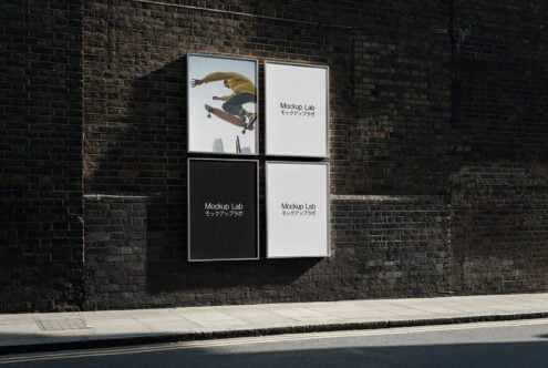 Four poster frames on industrial brick wall with skateboarder image visible