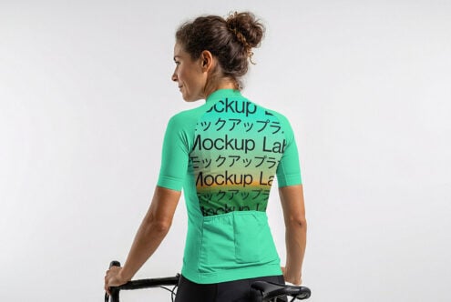 Female cyclist in bright green jersey mockup on stationary bike