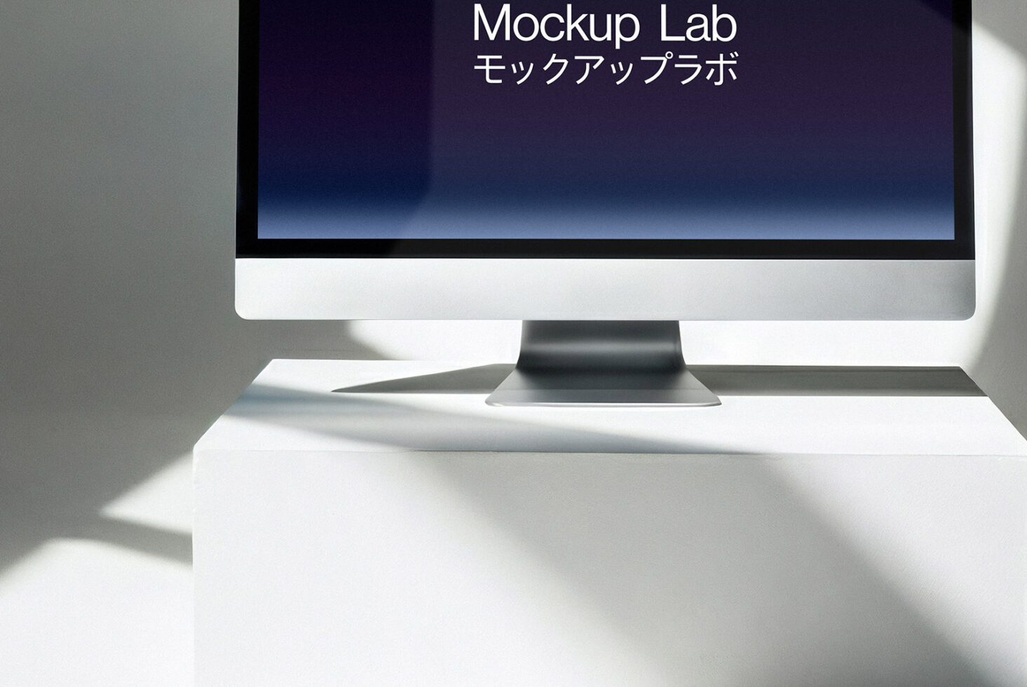 Desktop monitor on white surface showing blue gradient screen with text