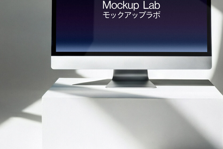 Desktop monitor on white surface showing blue gradient screen with text