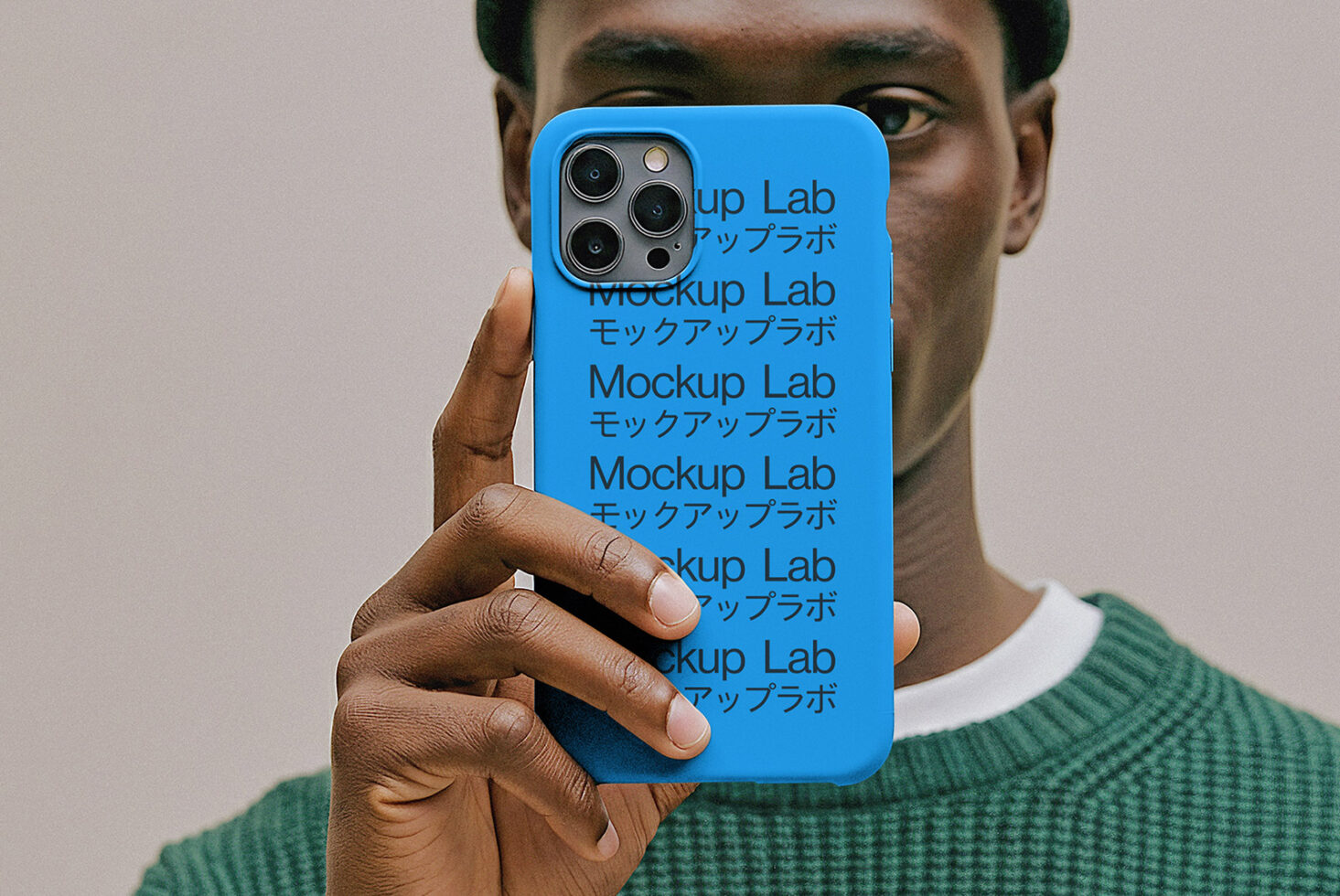 iPhone 12 Pro case mockup in bright blue held in hand showing triple camera lens