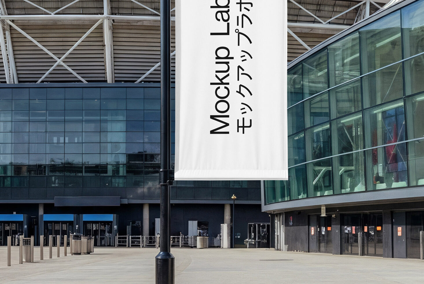 Large white banner hanging on modern building facade with glass windows