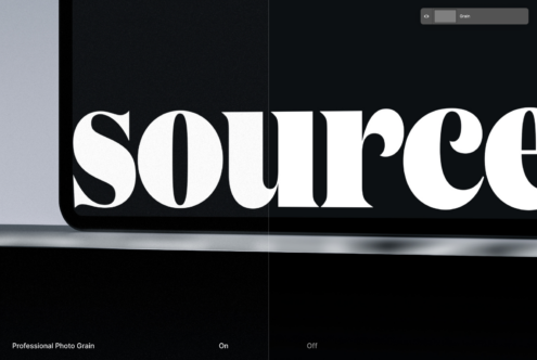 Bold serif type on black monitor with photo grain texture overlay