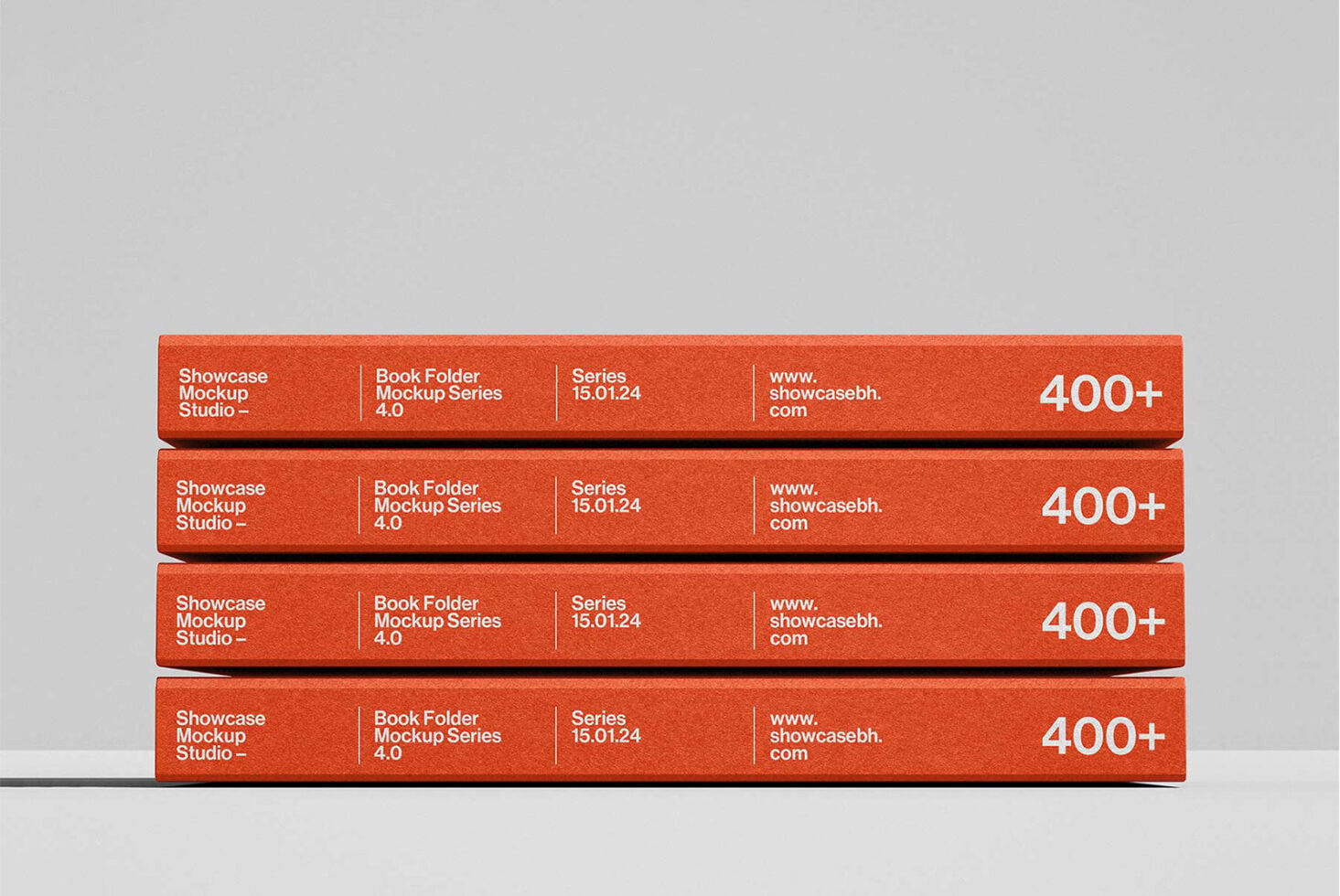 Stack of four red book folders with rounded edges on neutral gray background