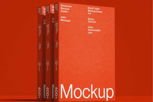 Four red book spines arranged at angles on deep red background studio shot