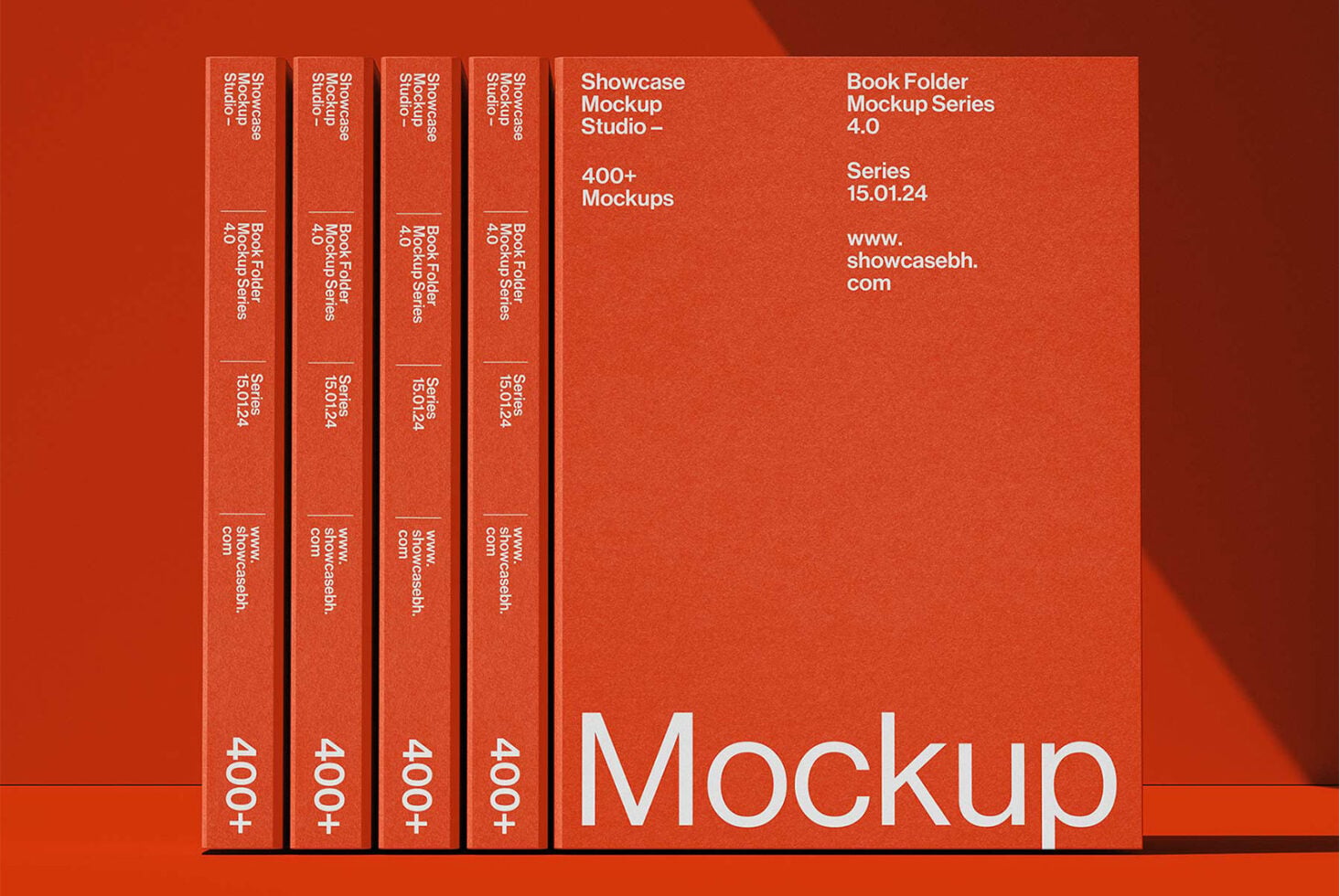 Four red books lined up next to larger red book cover on red background