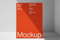 Red book displayed standing against neutral background with shadow