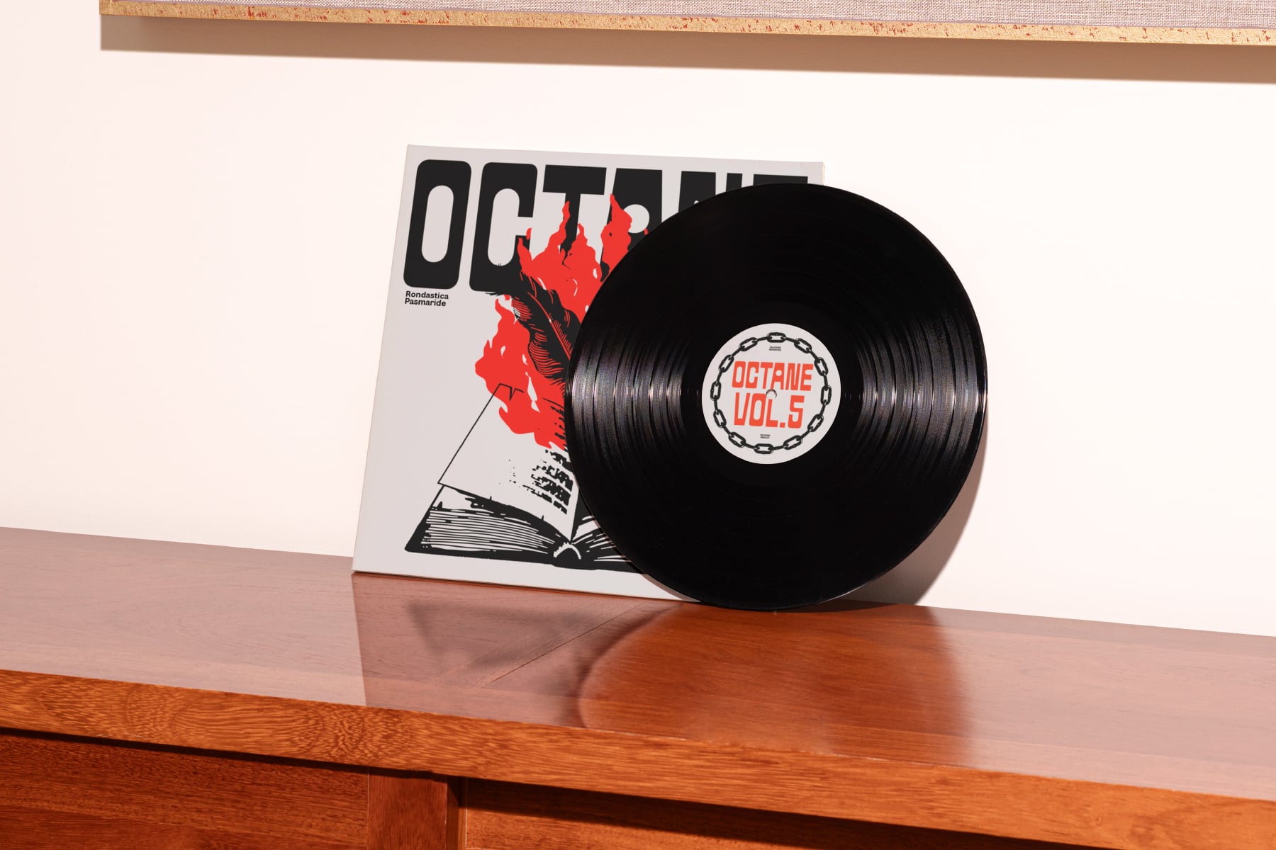 Vinyl record cover leaning on wood shelf red graphic layout mockup