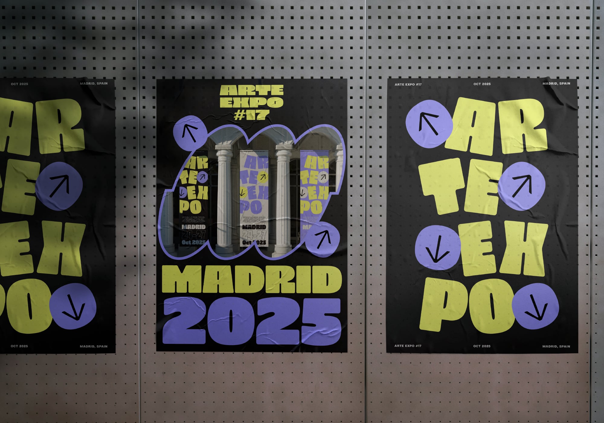 Posters on perforated wall showing bold yellow letters with purple circular design elements