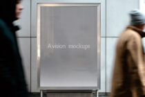 Blank lightbox mockup on urban storefront with neutral gray screen background