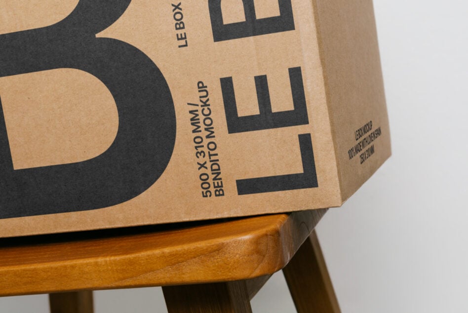 Natural kraft packaging mockup with bold black X on wooden base