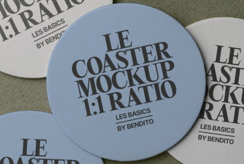Close up of round coaster in blue with serif typography on neutral background