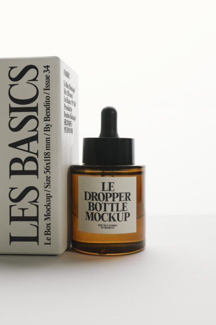 Amber glass dropper bottle with black cap next to product box mockup