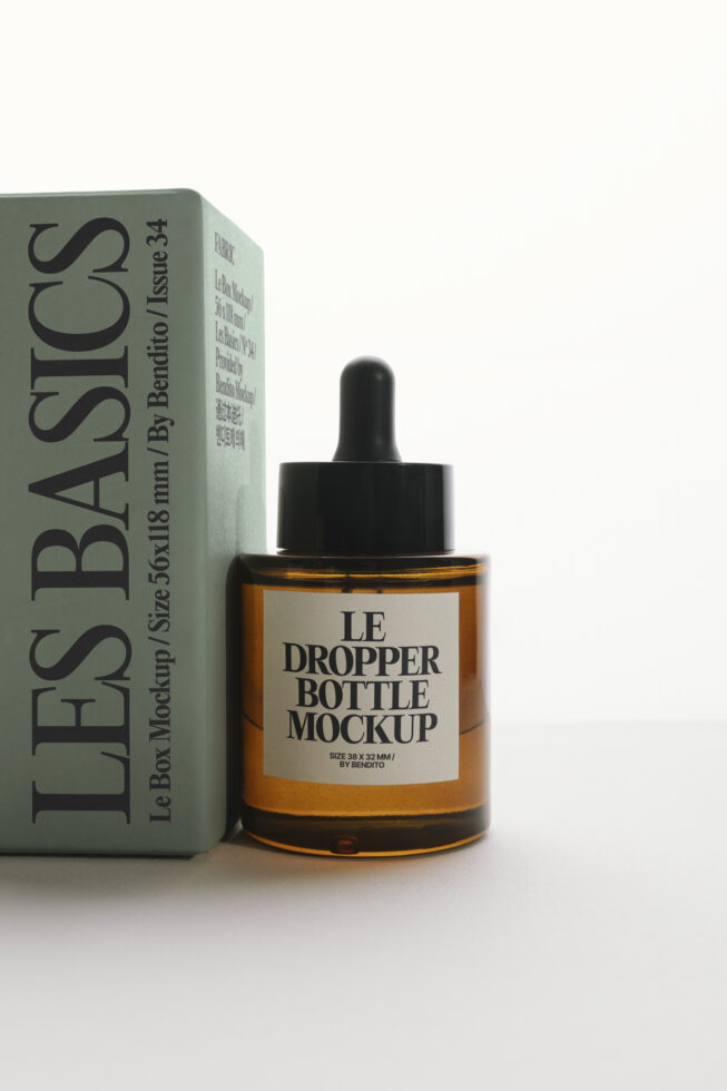 Amber dropper bottle with black cap next to green product box packaging