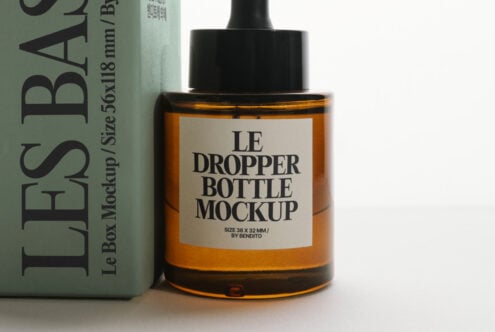 Amber dropper bottle with label displayed beside sage green box packaging