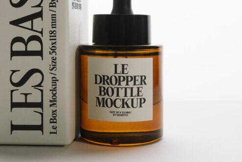 Dropper bottle mockup with cream label positioned next to white product box