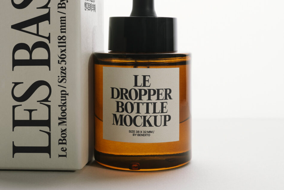 Dropper bottle mockup with cream label positioned next to white product box