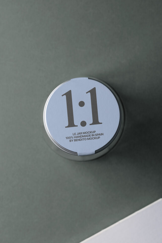 Round jar lid mockup with 1.1 text on pale blue label against sage wall