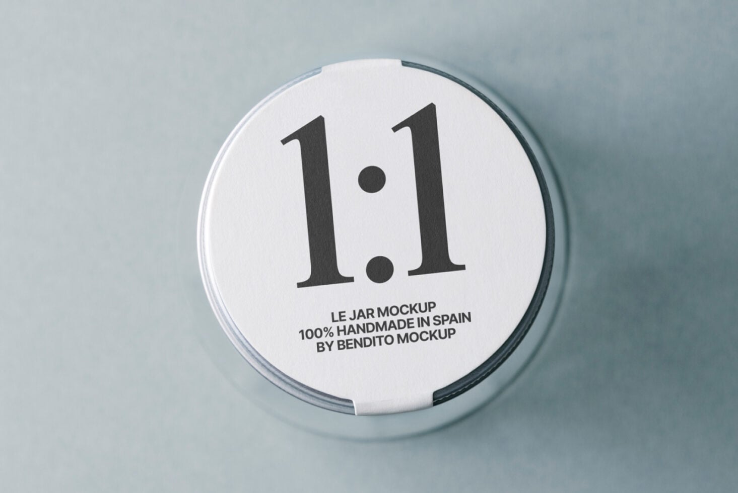Circular jar lid mockup with 1.1 label on neutral background, top view