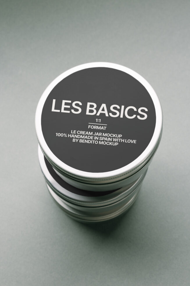 Stacked cream jar with dark label showing Les Basics branding, shot from above
