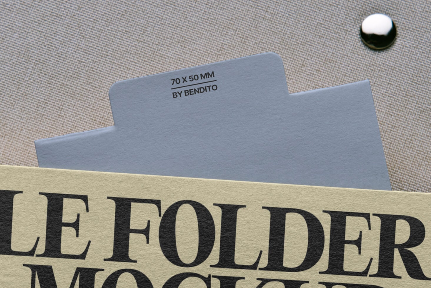 Folder design mockup with cream label text partially visible on textile background