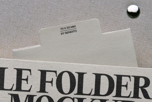Folder mockup showing cream card label with serif typography on neutral surface