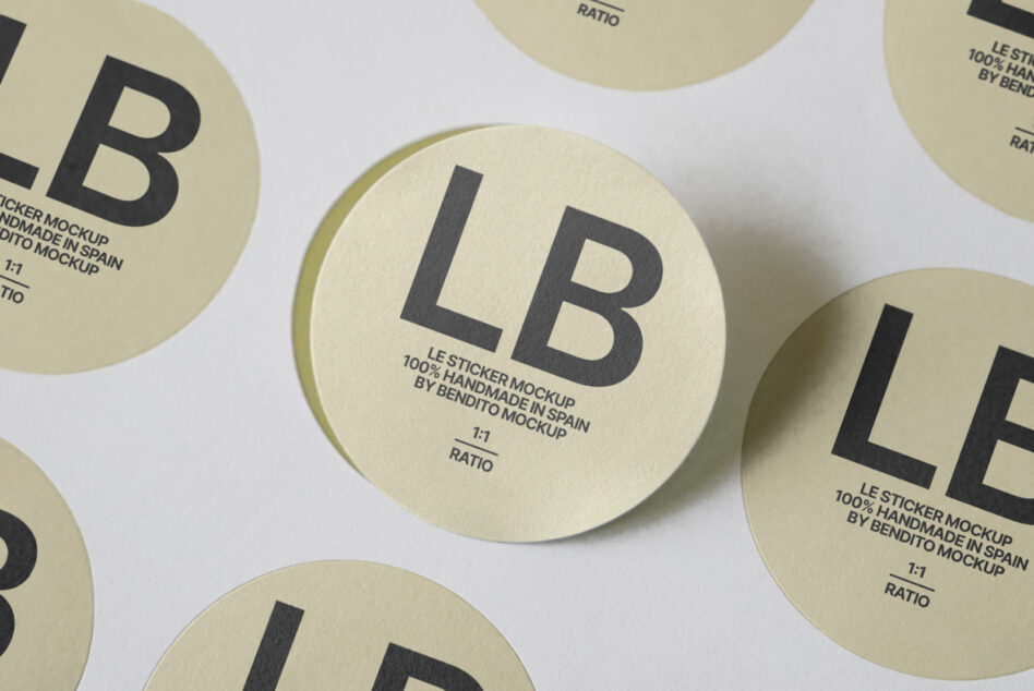 Cream round stickers featuring LB logo with subtle shadows on light surface