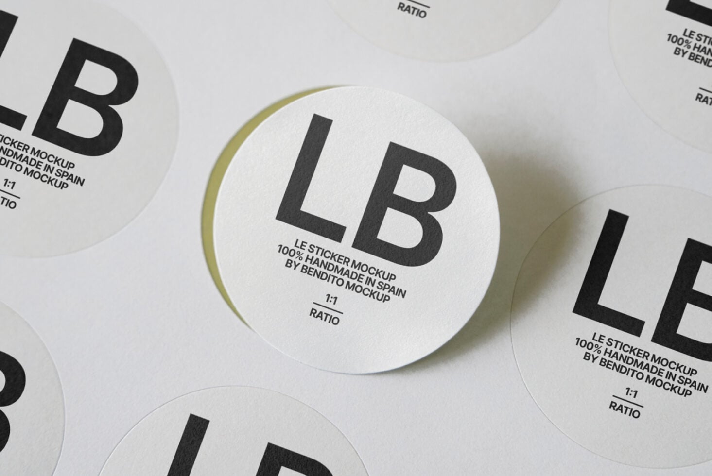 White circular stickers displaying LB branding with soft drop shadows overhead