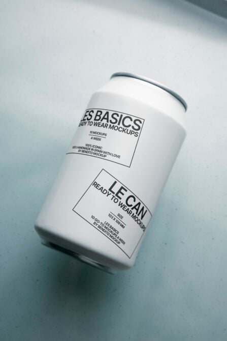 White aluminum can mockup with two rectangular label zones, simple serif type design