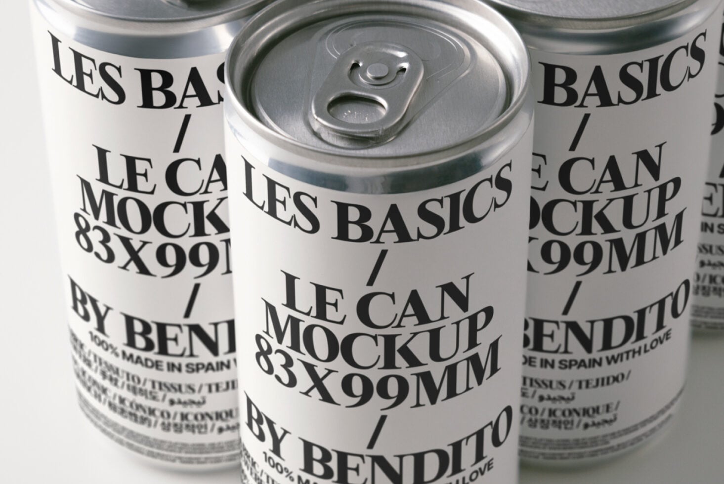 Three cans arranged showing pull tabs, cream labels with layered typography design