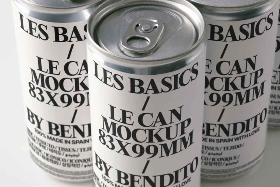 Three cans arranged showing pull tabs, cream labels with layered typography design