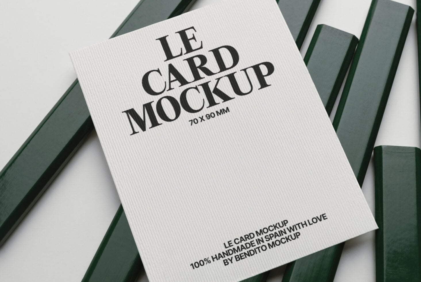 White ribbed business card mockup 70x90mm with bold serif text on green striped backdrop