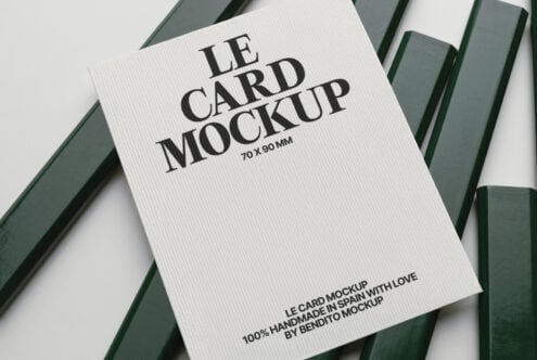 White ribbed business card mockup 70x90mm with bold serif text on green striped backdrop
