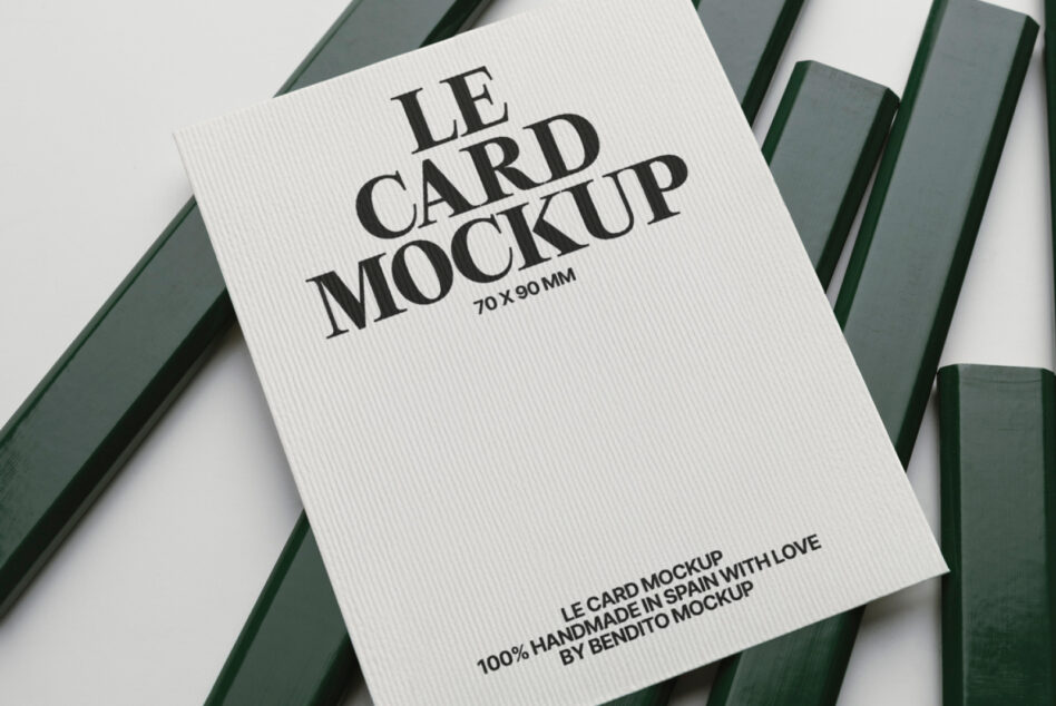 White ribbed business card mockup 70x90mm with bold serif text on green striped backdrop