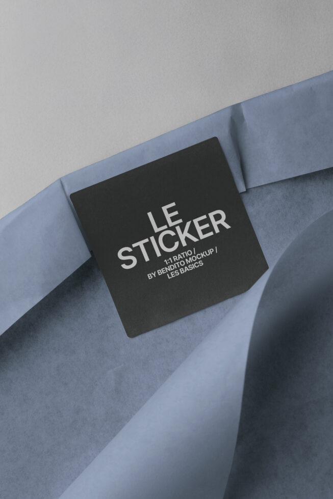 Black square sticker mockup on blue tissue paper with Les Basics branding