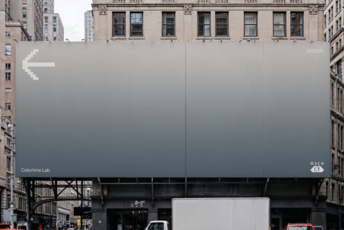 Large billboard mockup on city building with blank gray surface