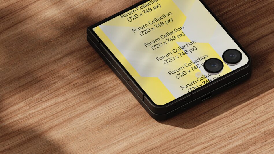 Foldable smartphone displaying graphic design mockup on a wooden table. Digital gadget with dual camera. Ideal for showcasing mobile UI templates.
