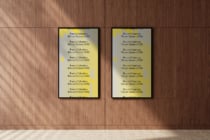 Two yellow phone screens mounted on wood wall with geometric corner accents