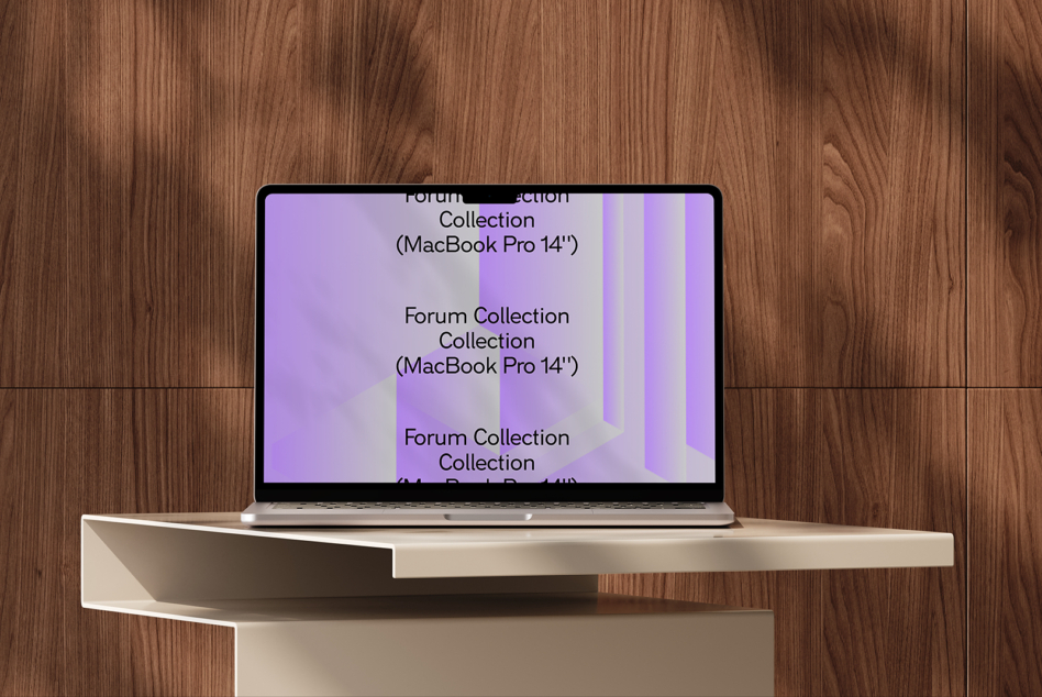 MacBook Pro 14 inch showing purple geometric design on wooden desk