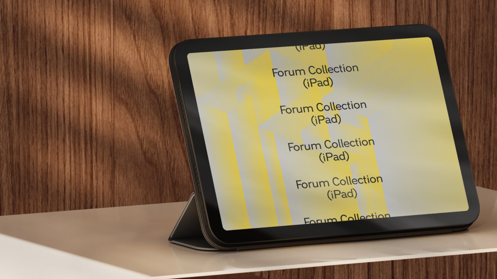 iPad mockup displaying yellow graphic design Forum Collection text on wooden background ideal for designers seeking device presentation templates
