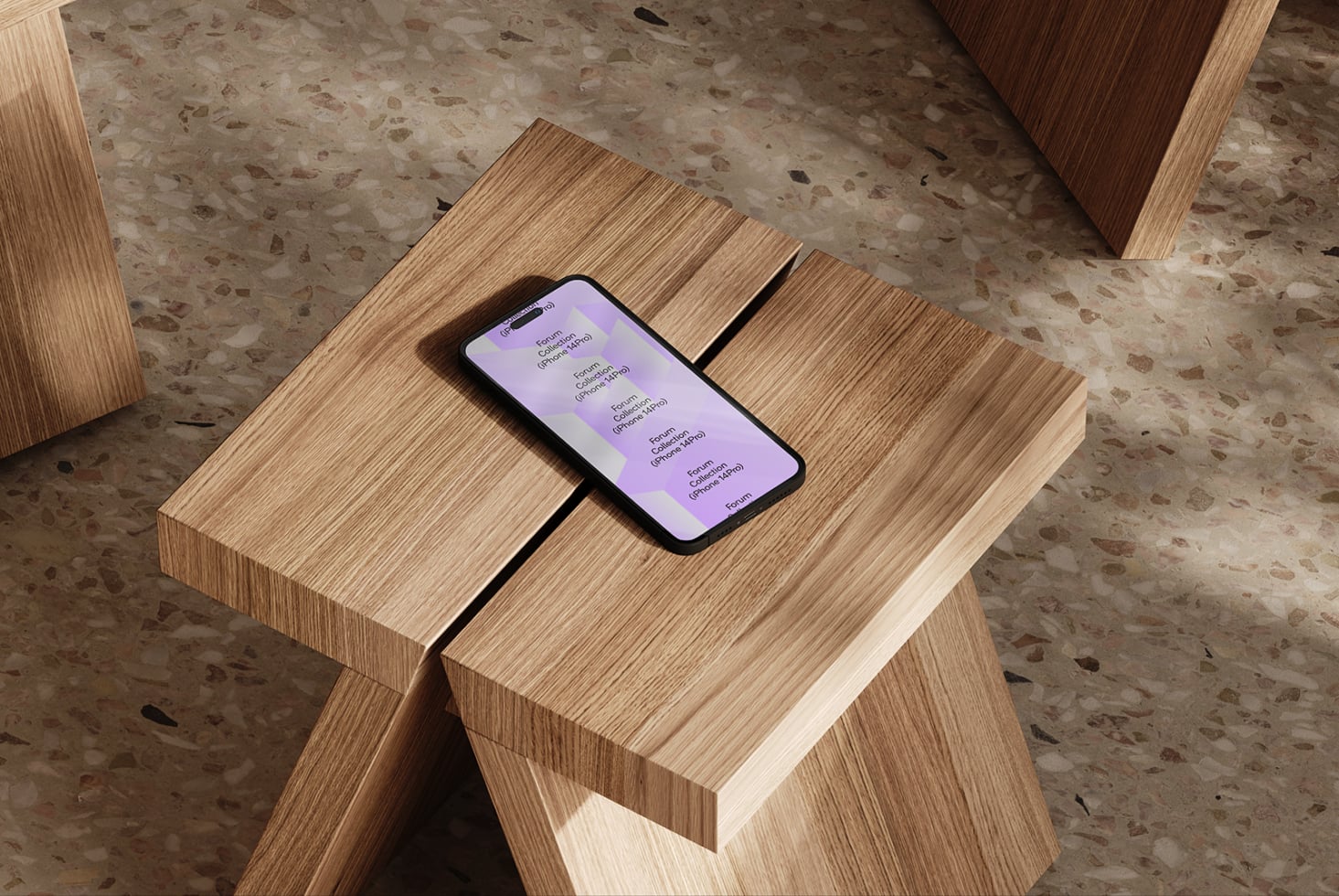 iPhone on wooden table showing purple gradient screen in modern space