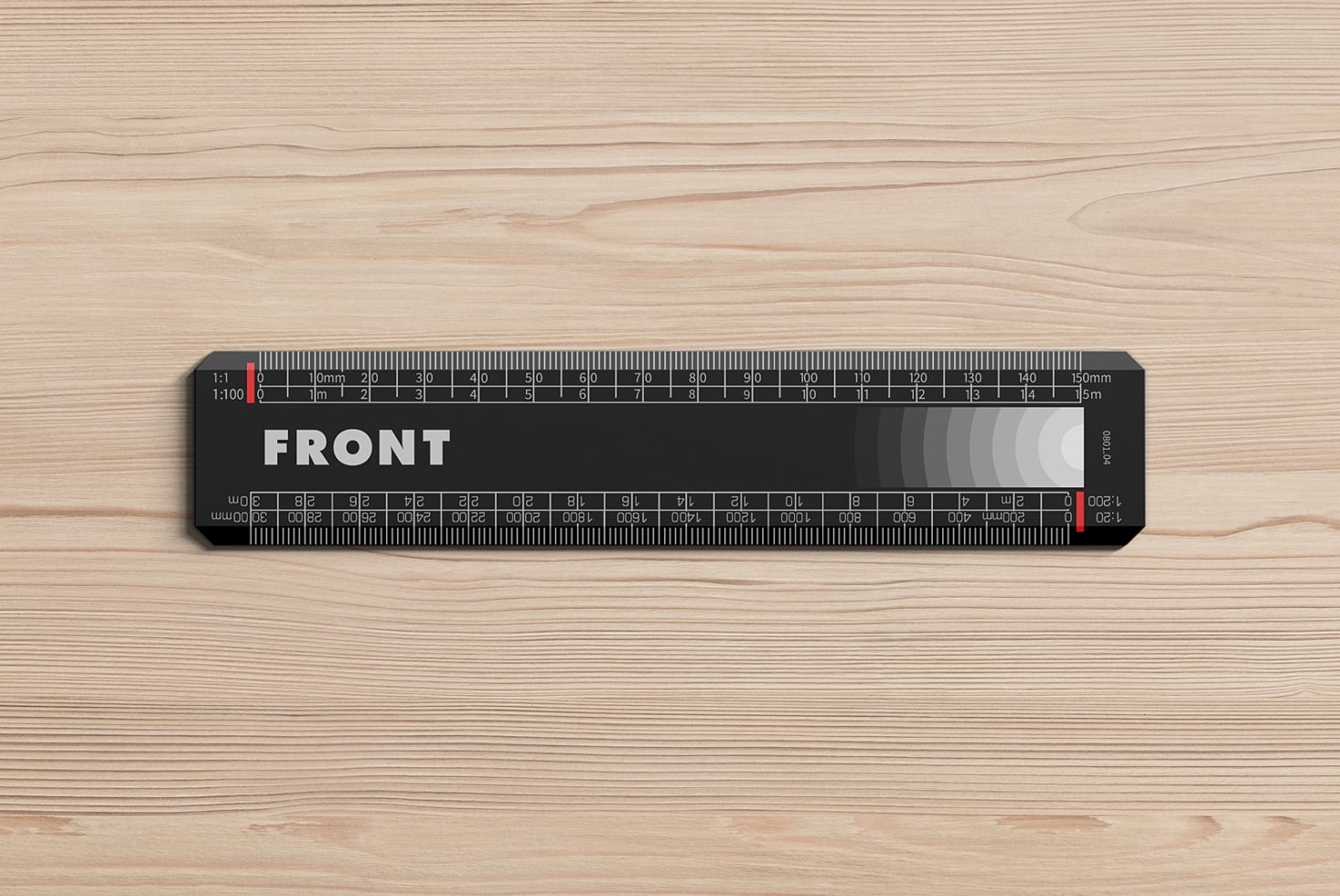 Black scale ruler with white markings on light wooden surface flat lay