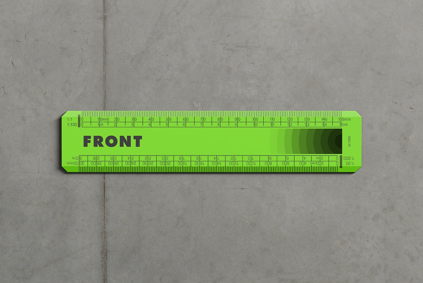 Neon green scale ruler with detailed markings on concrete floor backdrop