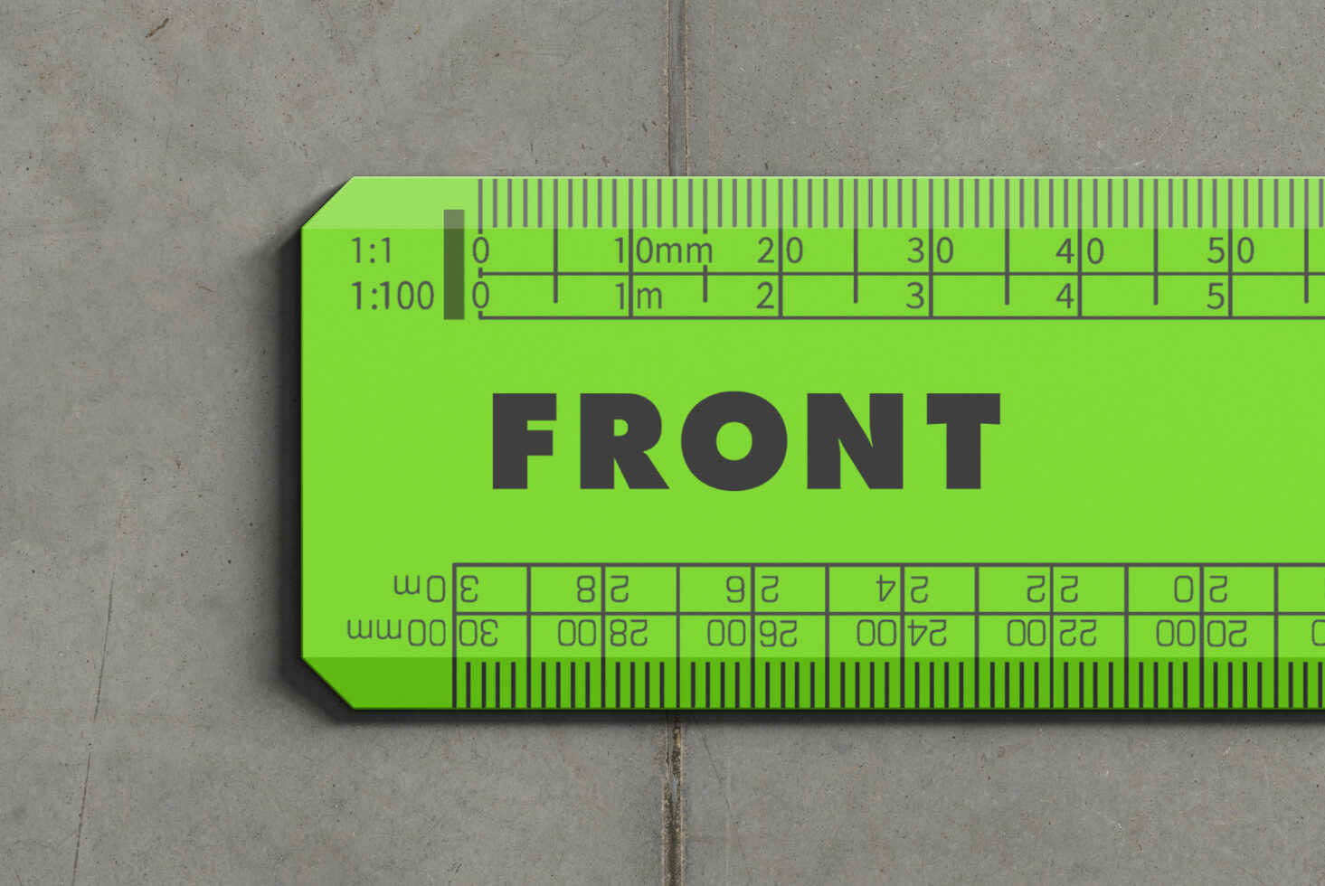 Bright lime green scale ruler mockup with measurement markings on concrete background