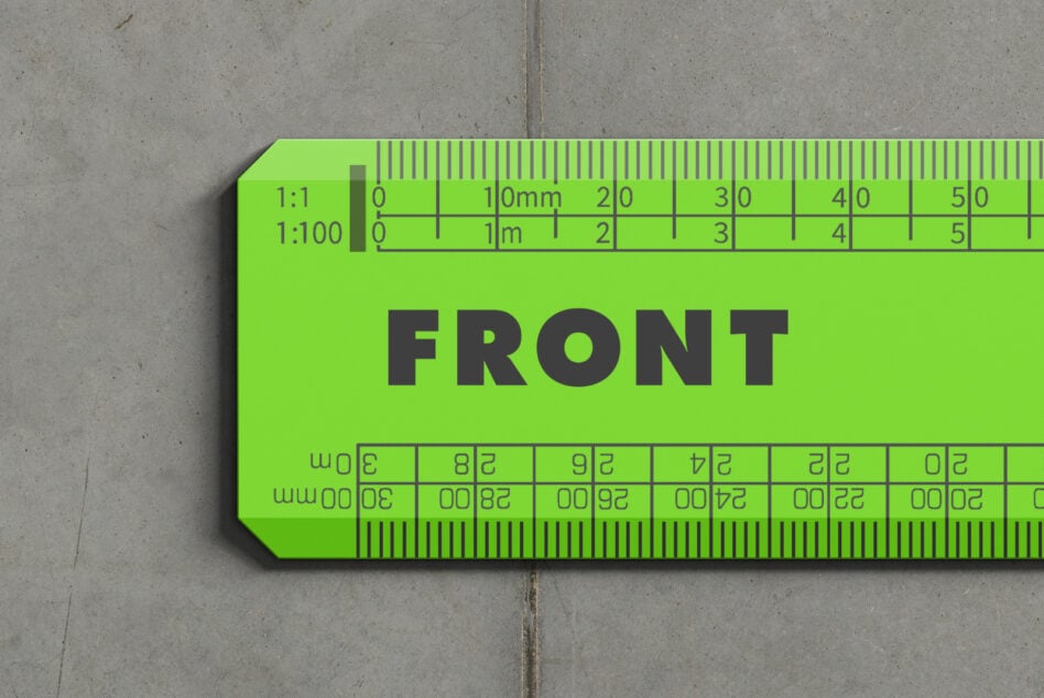 Bright lime green scale ruler mockup with measurement markings on concrete background