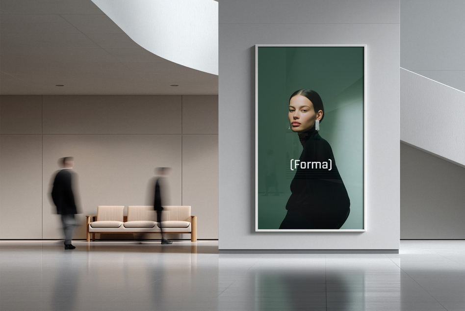 Corporate hallway showing woman's portrait in green-bordered frame