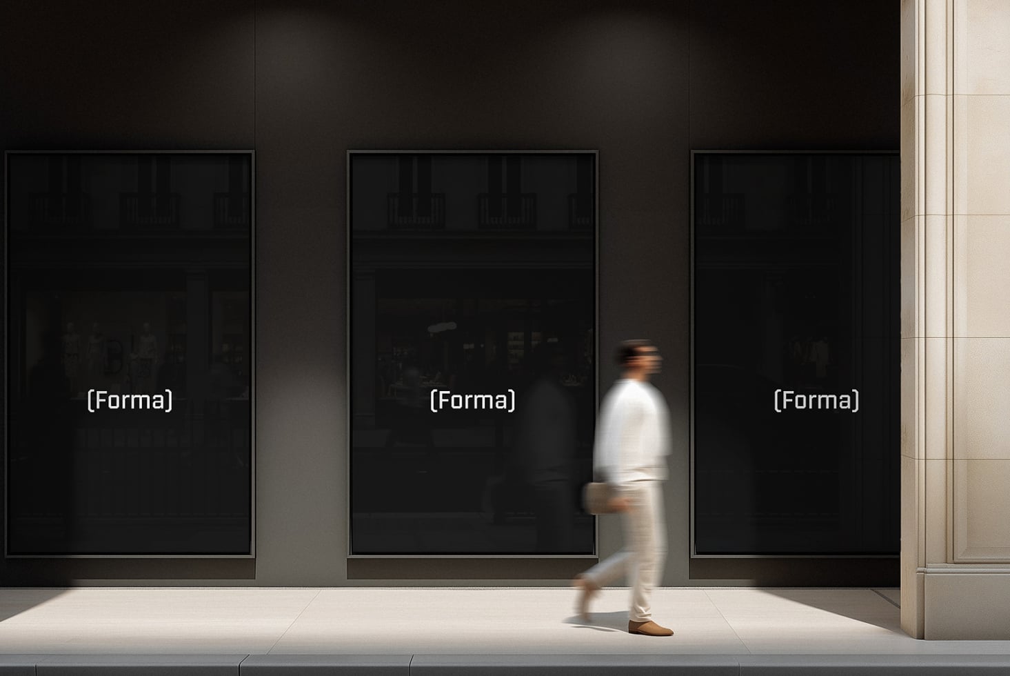 Modern gallery installation with three frames on dark wall interior