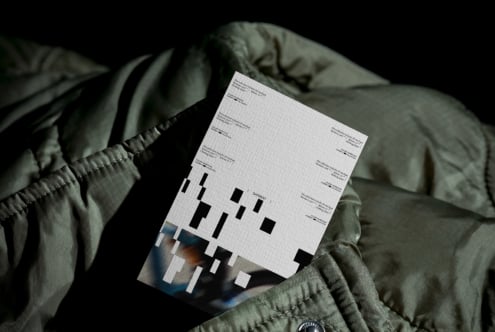 White label mockup layered on top of orange version, shot on quilted fabric