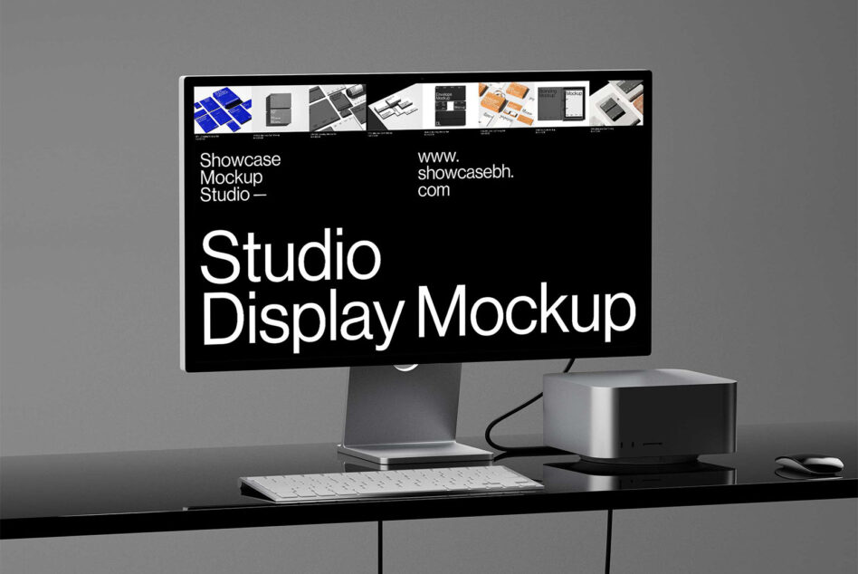 Studio monitor mockup on desk displaying website portfolio layout with keyboard mouse